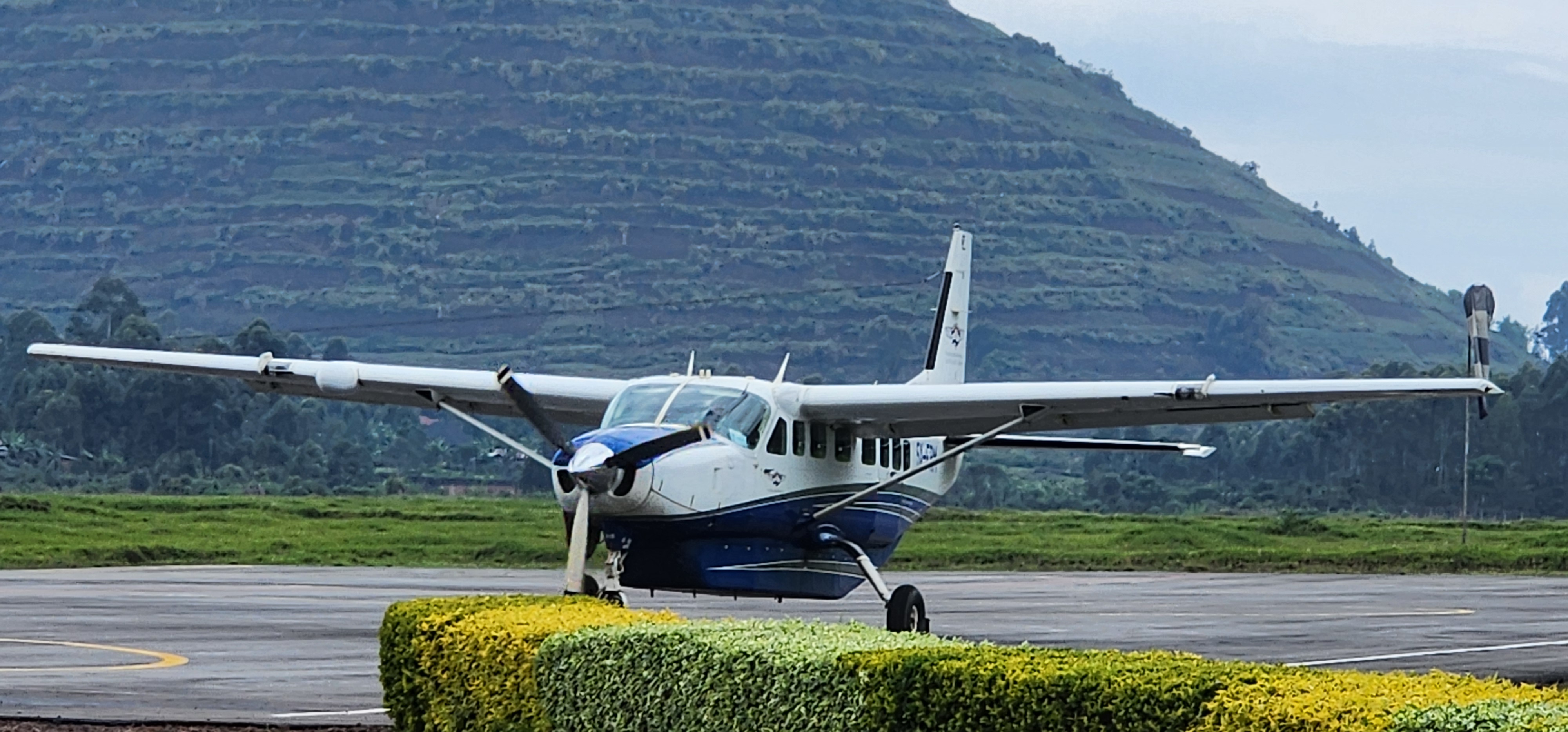 A bar aviation plane landing with tourists at Kisoro airport