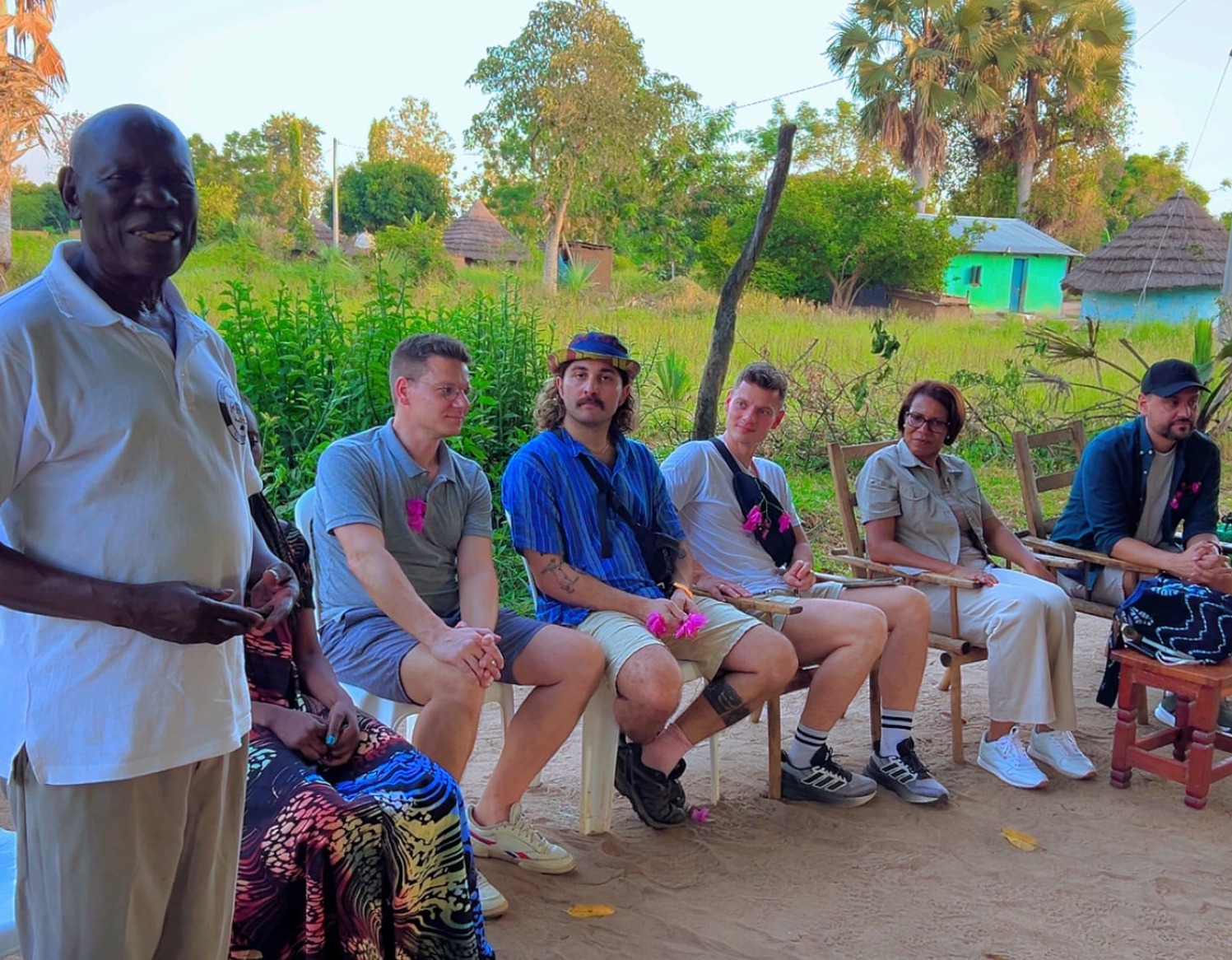 Guests lead by the Ms Lilly Ajarova, the CEO of Uganda tourism board watching the Amor group of women performing the Oraki dance at Amor.