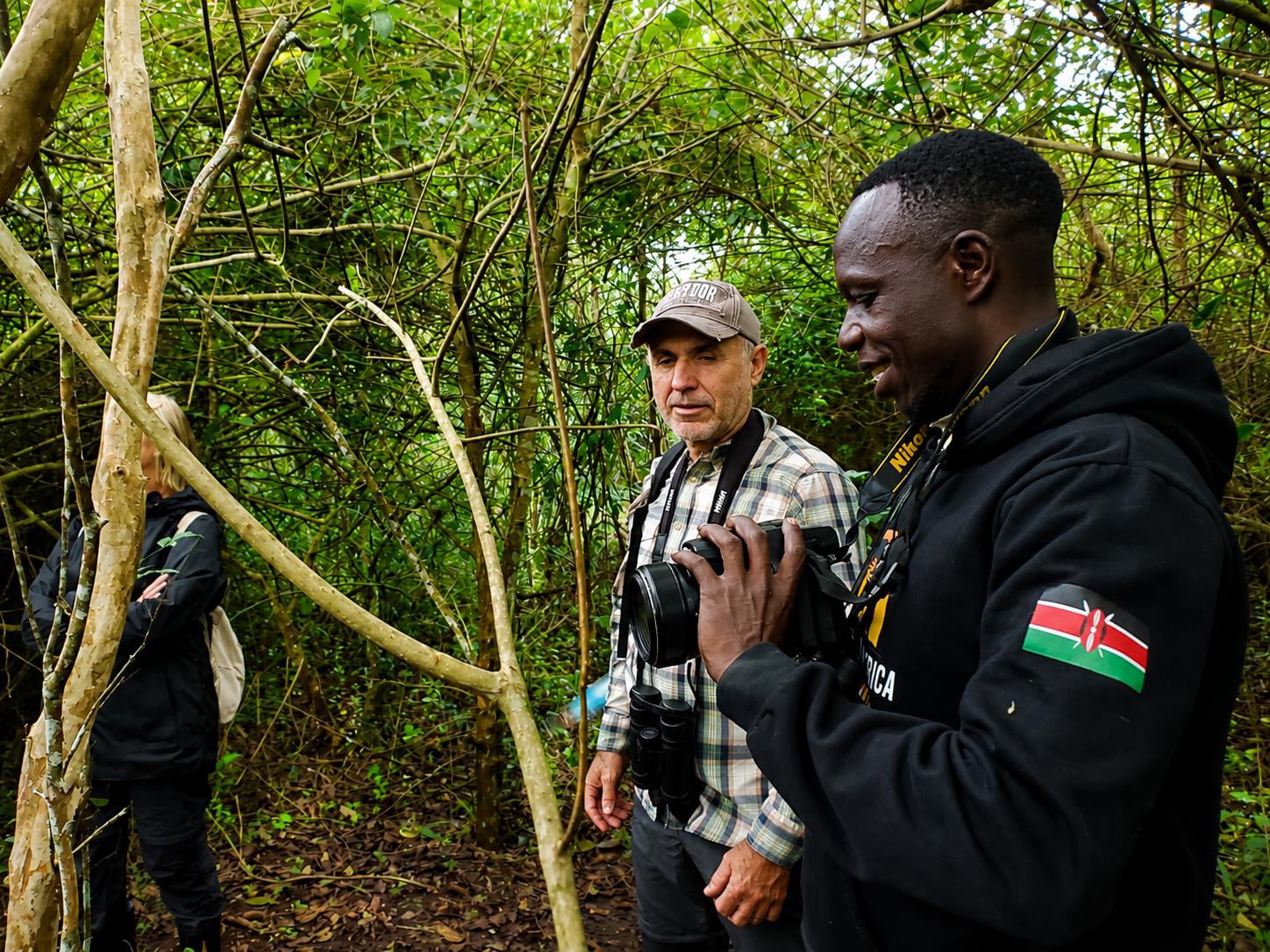 Francis the lead guide at Angara tours explaining to the tourists inside Bigodi wetland recently